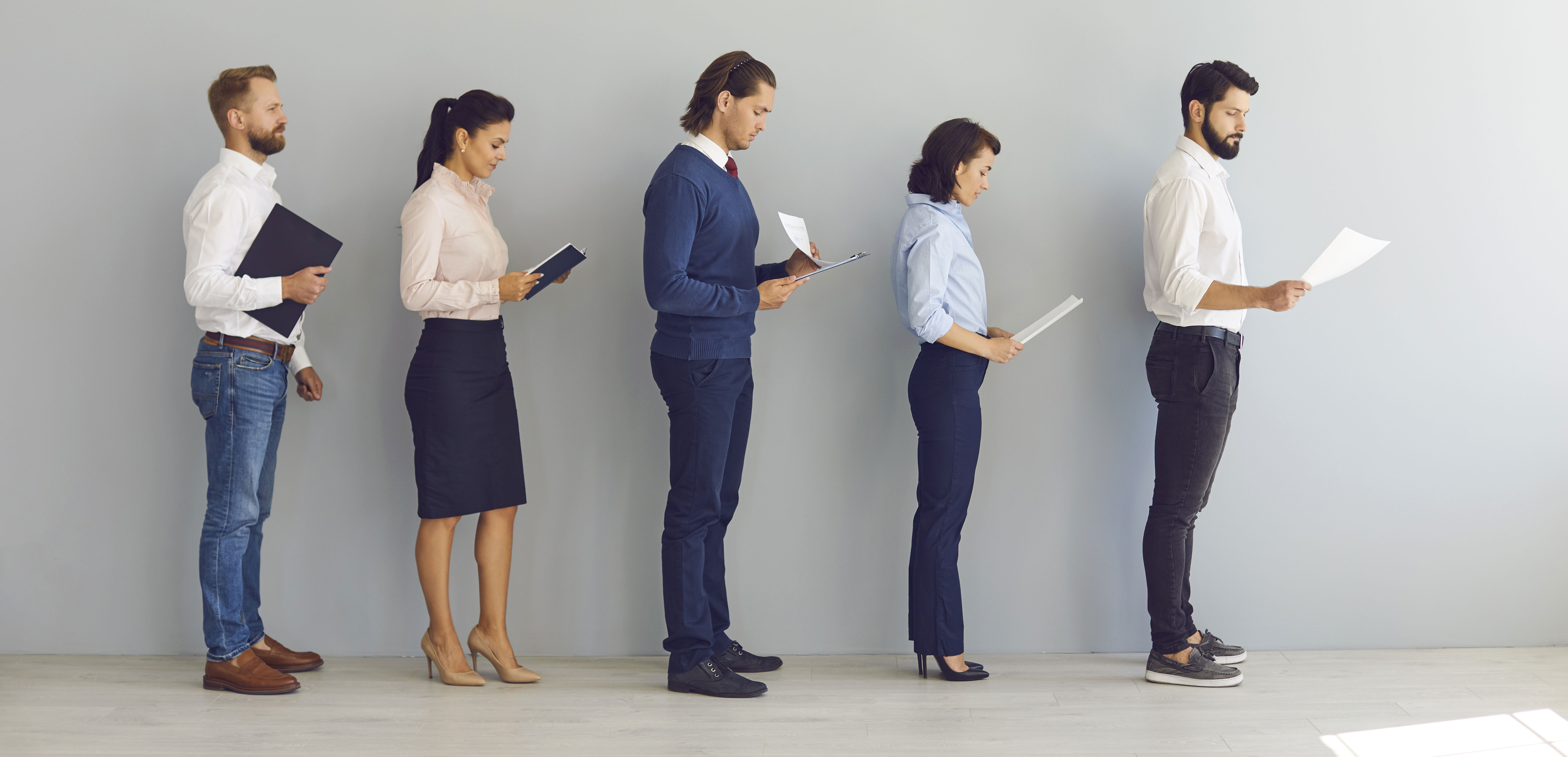 A group of job applicants standing in line.